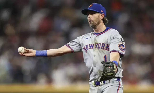 New York Mets second baseman Jeff McNeil throws to first base in the seventh inning of a baseball game against the Atlanta Braves, Thursday, June 19, 2025, in Atlanta. (AP Photo/Colin Hubbard)