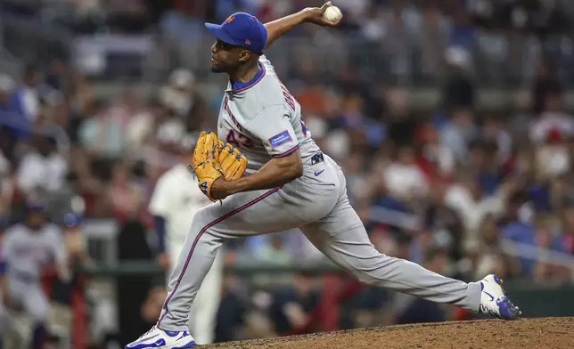 New York Mets pitcher Huascar Brazobán delivers in the sixth inning of a baseball game against the Atlanta Braves, Thursday, June 19, 2025, in Atlanta. (AP Photo/Colin Hubbard)