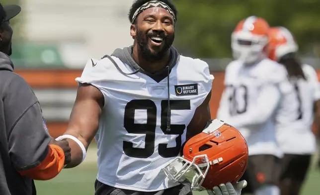 Cleveland Browns defensive end Myles Garrett (95) laughs at NFL football minicamp in Berea, Ohio, Tuesday, June 10, 2025. (AP Photo/Sue Ogrocki)