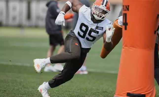 Cleveland Browns defensive end Myles Garrett (95) participates in a drill at NFL football minicamp in Berea, Ohio, Tuesday, June 10, 2025. (AP Photo/Sue Ogrocki)