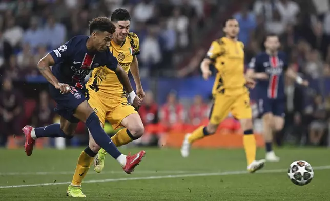 PSG's Desire Doue scores his side's third goal during the Champions League final soccer match between Paris Saint Germain and Inter Milan, at the Allianz Arena in Munich, Germany, Saturday, May 31, 2025. (Sven Hoppe/dpa via AP)