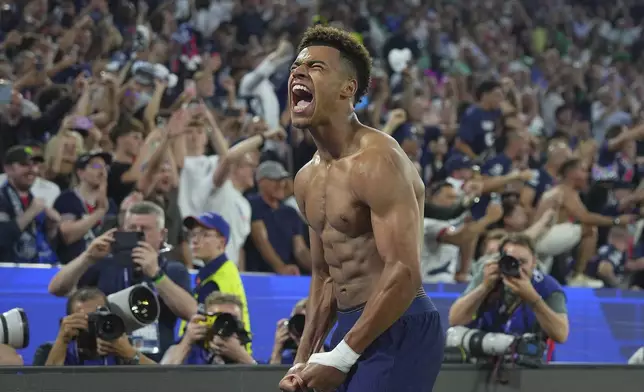 PSG's Desire Doue celebrates after scoring his side's third goal during the Champions League Final soccer match between Paris Saint Germain and Inter at the Allianz Arena in Munich, Germany, Saturday May 31, 2025 . (Spada/LaPresse via AP)