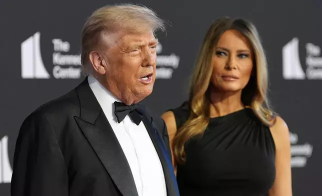 President Donald Trump and first lady Melania Trump arrive to view opening night of "Les Miserables," at the Kennedy Center, Wednesday, June 11, 2025, in Washington. (AP Photo/Alex Brandon)