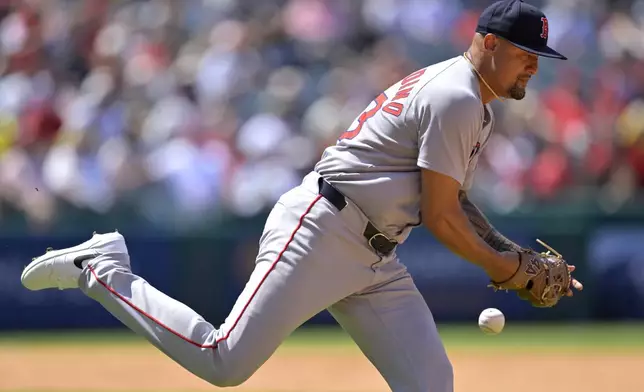 Boston Red Sox relief pitcher Brennan Bernardino has trouble fielding a bunt by Los Angeles Angels' Taylor Ward in the sixth inning of a baseball game Wednesday, June 25, 2025, in Anaheim, Calif. (AP Photo/Jayne Kamin-Oncea)