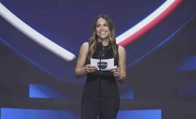 Meredith Gaudreau, widow of Johnny Gaudreau, speaks during the NHL hockey draft Friday, June 27, 2025, in Los Angeles. (AP Photo/Damian Dovarganes)