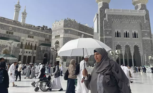 Muslim pilgrims enter the Grand Mosque, during the annual Hajj pilgrimage in Mecca, Saudi Arabia, Monday, June 2, 2025. (AP Photo/Amr Nabil)