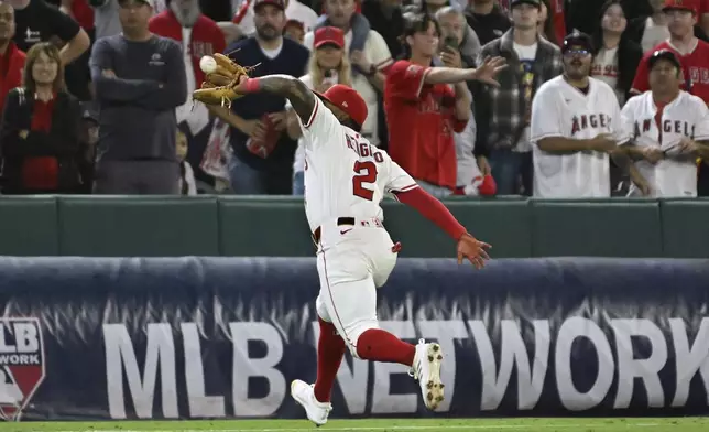 Los Angeles Angels third base Luis Rengifo (2) makes a catch for the last out in the ninth inning against the Houston Astros in a baseball game Saturday, June 21, 2025, in Anaheim, Calif. (AP Photo/Wally Skalij)