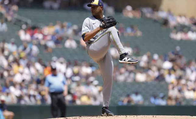 Milwaukee Brewers starting pitcher Jose Quintana winds up to throw during the first inning of a baseball game against the Minnesota Twins, Saturday, June 21, 2025, in Minneapolis. (AP Photo/Bailey Hillesheim)