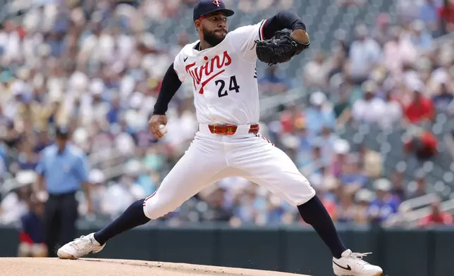 Minnesota Twins starting pitcher Simeon Woods Richardson (24) delivers during the first inning of a baseball game against the Milwaukee Brewers, Saturday, June 21, 2025, in Minneapolis. (AP Photo/Bailey Hillesheim)