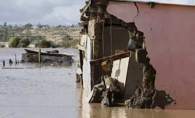 A view of homes submerged in floodwater, in Mthatha, South Africa, Tuesday, June 10, 2025. (AP Photo/Hoseya Jubase)