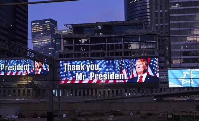 An electronic billboard beams an image of President Donald Trump alongside the message "Thank you, Mr. President" referring to the U.S. involvement in the war between Israel and Iran, in Ramat Gan, Israel, Sunday, June 22, 2025. (AP Photo/Bernat Armangue)
