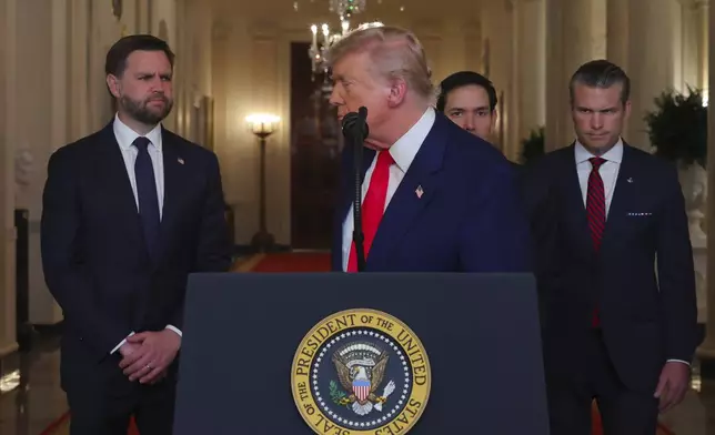 President Donald Trump turns from the podium after speaking from the East Room of the White House in Washington, Saturday, June 21, 2025, after the U.S. military struck three Iranian nuclear and military sites, directly joining Israel's effort to decapitate the country's nuclear program, as Vice President JD Vance, Secretary of State Marco Rubio and Defense Secretary Pete Hegseth listen. (Carlos Barria/Pool via AP)