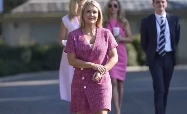 White House press secretary Karoline Leavitt walks over to speak with reporters at the White House, Monday, June 23, 2025, in Washington. (AP Photo/Evan Vucci)