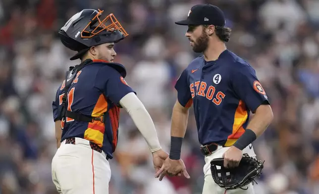 Houston Astros catcher Yainer Diaz, left, and center fielder Jacob Melton celebrate after winning a baseball game against the Tampa Bay Rays in Houston, Sunday, June 1, 2025. (AP Photo/Ashley Landis)