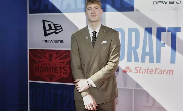 Kasparas Jakucionis arrives for the first round of the NBA basketball draft, Wednesday, June 25, 2025, in New York. (AP Photo/Adam Hunger)