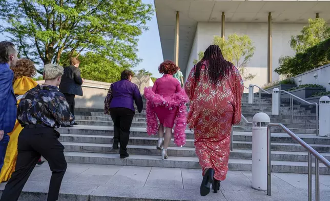 Tara Hoot, Maria Con Carne, Ricky Rosé and Vagenesis walk to the Kennedy Center, Wednesday, June 11, 2025, in Washington, to attend Les Miserables. (AP Photo/Julia Demaree Nikhinson)