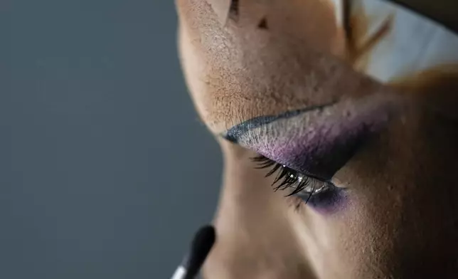 Mari Con Carne applies their makeup before attending Les Miserables at the Kennedy Center in drag, on the night that President Donald Trump and first lady Melania Trump were also in attendance, Wednesday, June 11, 2025, in Washington. (AP Photo/Julia Demaree Nikhinson)