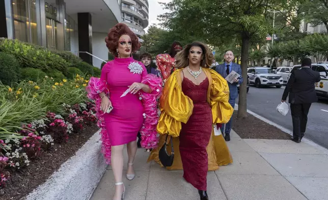 Tara Hoot, Maria Con Carne, Ricky Rosé and Vagenesis walk to the Kennedy Center, Wednesday, June 11, 2025, in Washington to attend a performance of Les Miserables, that President Donald Trump and first lady Melania Trump were also attending. (AP Photo/Julia Demaree Nikhinson)