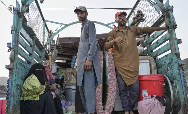 Repatriated Afghan refugees arrive at a camp after crossing the Pakistan-Afghanistan border, in Torkham, Afghanistan, Saturday, May 31, 2025. (AP Photo/Ebrahim Noroozi)