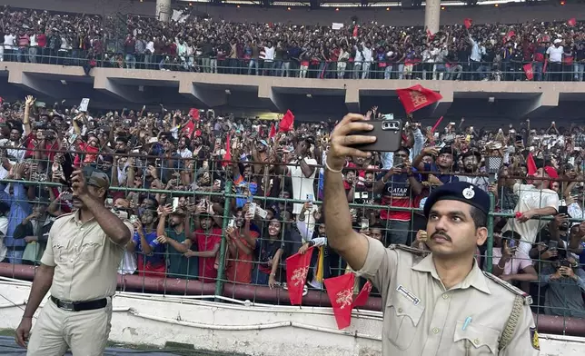 Fans gather to celebrate Royal Challengers Bengaluru cricketers, winners of the Indian Premier League, at the M. Chinnaswamy Stadium in Bengaluru, India, Wednesday, June 4, 2025. (AP Photo/Aijaz Rahi)