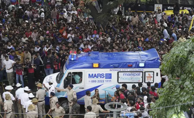 An ambulance arrives at the M. Chinnaswamy Stadium as fans gather to celebrate Royal Challengers Bengaluru cricketers, winners of the Indian Premier League, in Bengaluru, India, Wednesday, June 4, 2025. (AP Photo/Aijaz Rahi)