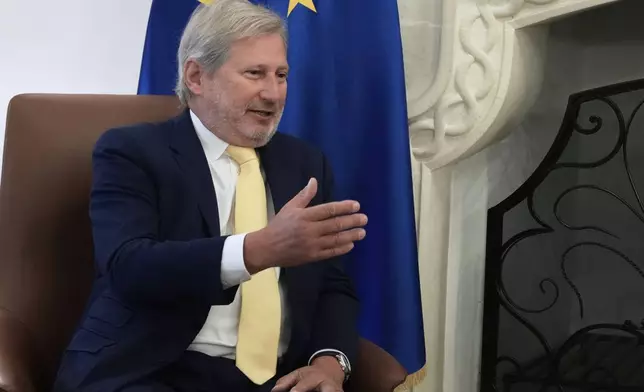 The European Union special envoy for Cyprus Johannes Chan talks with Cyprus' President Nikos Christodoulides during their meeting at the presidential palace in divided capital Nicosia, Cyprus, Tuesday, June 24, 2025. (AP Photo/Petros Karadjias)