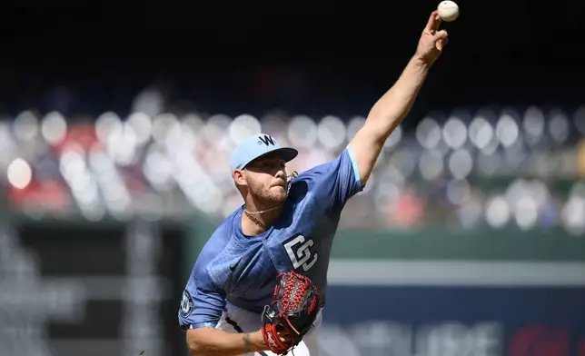 Washington Nationals starting pitcher Mitchell Parker (70) throws during the first inning of a baseball game against the Texas Rangers, Saturday, June 7, 2025, in Washington. (AP Photo/Nick Wass)