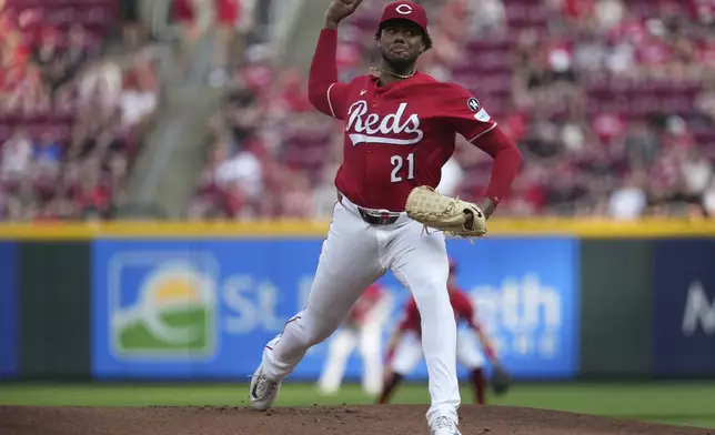 Cincinnati Reds' Hunter Greene delivers a pitch in the first inning of a baseball game against the Milwaukee Brewers, Tuesday, June 3, 2025, in Cincinnati. (AP Photo/Kareem Elgazzar)