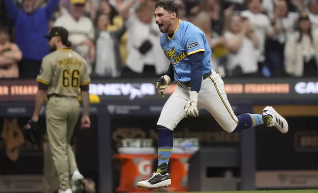 Milwaukee Brewers' Caleb Durbin reacts as he rounds the bases after hitting a walk off solo home run during the ninth inning of a baseball game against the San Diego Padres, Saturday, June 7, 2025, in Milwaukee. (AP Photo/Aaron Gash)