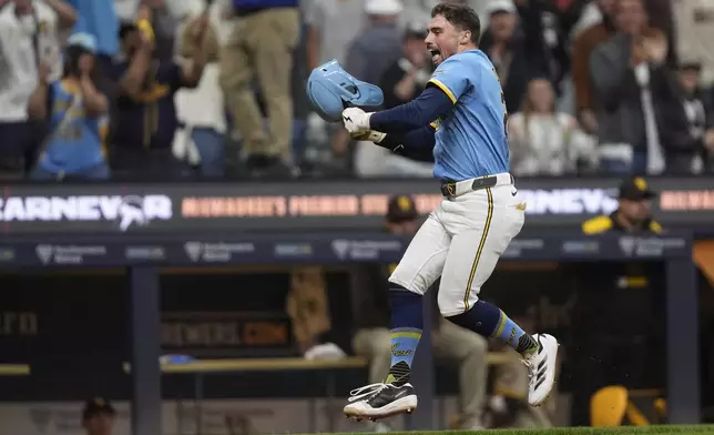 Milwaukee Brewers' Caleb Durbin reacts as he rounds the bases after hitting a walk off solo home run during the ninth inning of a baseball game against the San Diego Padres, Saturday, June 7, 2025, in Milwaukee. (AP Photo/Aaron Gash)