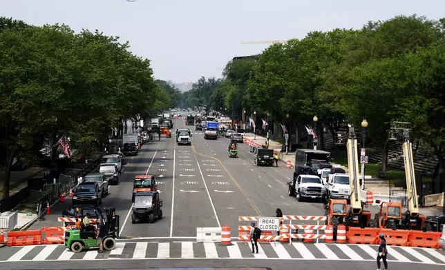 Preparations continue on Constitution Avenue ahead of an upcoming military parade commemorating the U.S. Army's 250th anniversary that coincides with President Donald Trump's 79th birthday, Friday, June 13, 2025, in Washington (AP Photo/Julia Demaree Nikhinson)