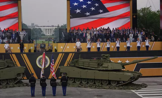 The National Anthem is performed as President Donald Trump attends a military parade commemorating the Army's 250th anniversary, coinciding with his 79th birthday, Saturday, June 14, 2025, in Washington. (AP Photo/Julia Demaree Nikhinson)