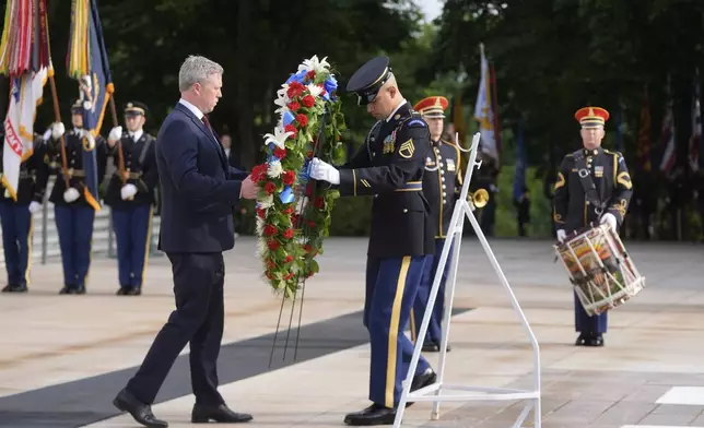 Secretary of the Army Daniel Driscoll lays a wreath at the Tomb of the Unknown Soldier at Arlington National Cemetery, honoring the Army's 250th anniversary and coinciding with President Donald Trump's 79th birthday, Saturday, June 14, 2025, in Arlington, Va. (AP Photo/Manuel Balce Ceneta)