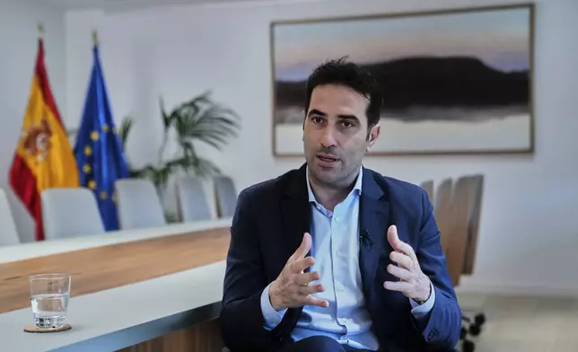 Spain's Economy Minister Carlos Cuerpo speaks during an interview with The Associated Press at the Economy Ministry in Madrid, Spain, Tuesday, June 10, 2025. (AP Photo/Paul White)