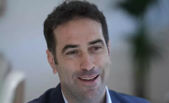 Spain's Economy Minister Carlos Cuerpo speaks during an interview with The Associated Press at the Economy Ministry in Madrid, Spain, Tuesday, June 10, 2025. (AP Photo/Paul White)