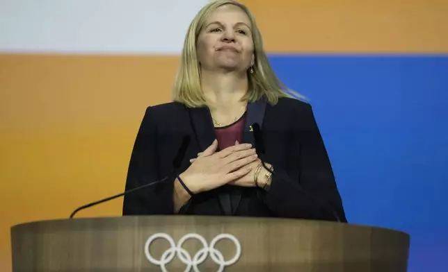 FILE -Kirsty Coventry reacts after she was announced as the new IOC President at the International Olympic Committee 144th session in Costa Navarino, western Greece, March 20, 2025. (AP Photo/Thanassis Stavrakis), File)