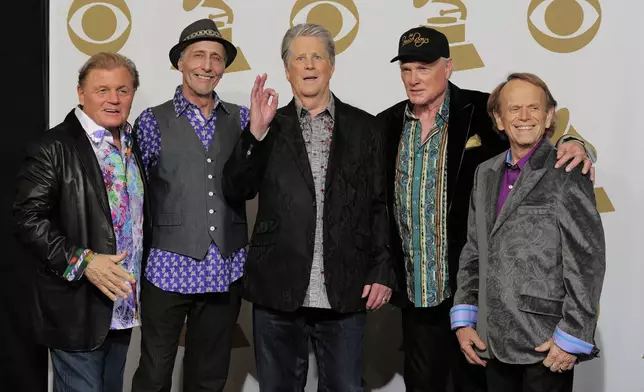 FILE - Members of The Beach Boys, from left, Bruce Johnston, David Marks, Brian Wilson, Mike Love and Al Jardine appear backstage at the 54th annual Grammy Awards in Los Angeles on Feb. 12, 2012. (AP Photo/Mark J. Terrill, File)
