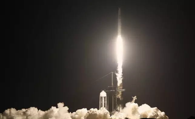 A SpaceX Falcon 9 rocket with a crew of four aboard a Dragon Spacecraft lifts off from pad 39A at the Kennedy Space Center in Cape Canaveral, Fla., Wednesday, June 25, 2025. (AP Photo/Terry Renna)