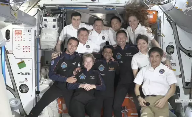 This image provided by NASA shows visiting crew in dark blue, Hungary's Tibor Kapu, left, Axiom Space's Peggy Whitson, center left, India's Shubhanshu Shukla, center right, and Poland's Slawosz Uznanski-Wisniewski aboard the International Space Station, Thursday June 26, 2025. (NASA via AP)