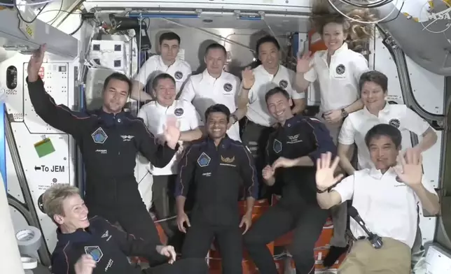 This image provided by NASA shows visiting crew in dark blue, Axiom Space's Peggy Whitson, left, Hungary's Tibor Kapu, 2nd left, India's Shubhanshu Shukla, center, and Poland's Slawosz Uznanski-Wisniewski, center right, aboard the International Space Station, Thursday June 26, 2025. (NASA via AP)