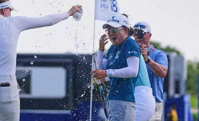 Minjee Lee celebrates after winning the Women's PGA Championship golf tournament, Sunday, June 22, 2025, in Frisco, Texas. (AP Photo/LM Otero)