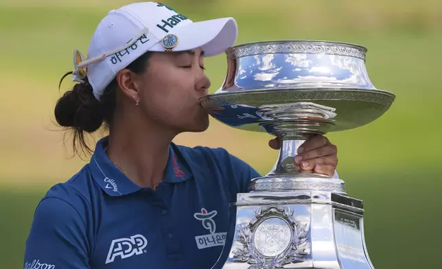 Minjee Lee kisses the trophy after winning the Women's PGA Championship golf tournament Sunday, June 22, 2025, in Frisco, Texas. (AP Photo/LM Otero)