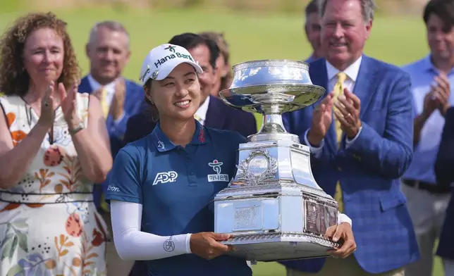 Minjee Lee holds the winner's trophy after winning the Women's PGA Championship golf tournament Sunday, June 22, 2025, in Frisco, Texas. (AP Photo/LM Otero)