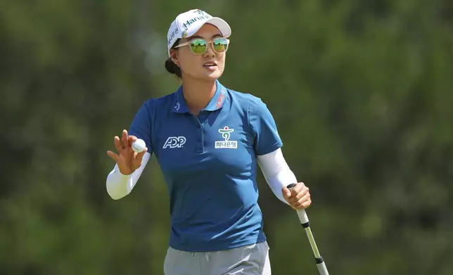 Minjee Lee waves after sinking a putt on the second green during the final round of the Women's PGA Championship golf tournament Sunday, June 22, 2025, in Frisco, Texas. (AP Photo/LM Otero)