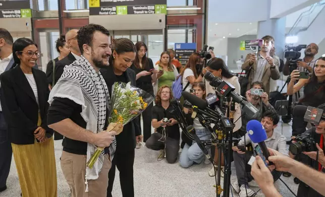 Mahmoud Khalil, second from left, alongside Rep. Alexandria Ocasio-Cortez, prepares to speak at a news conference upon arriving at Newark International Airport, Saturday, June 21, 2025, in Newark, N.J. (AP Photo/Seth Wenig)