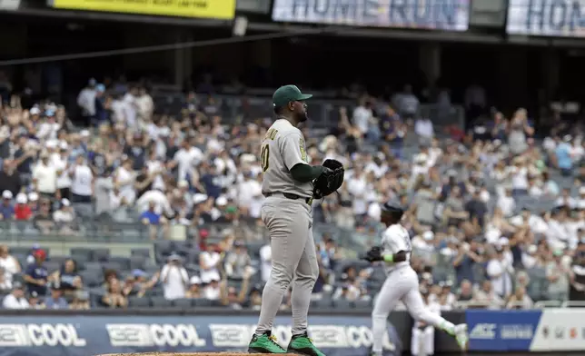 Athletics pitcher Luis Severino reacts after giving up a solo home run to New York Yankees' Jazz Chisholm Jr. during the second inning of a baseball game, Sunday, June 29, 2025, in New York. (AP Photo/Adam Hunger)