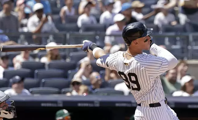 New York Yankees' Aaron Judge hits a two-run home run during the fourth inning of a baseball game against the Athletics, Sunday, June 29, 2025, in New York. (AP Photo/Adam Hunger)