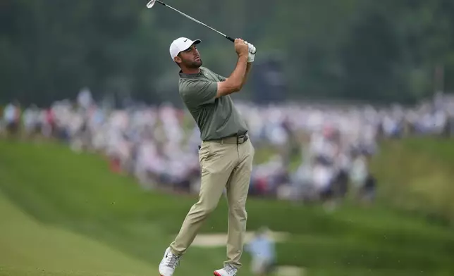 Scottie Scheffler plays on the third hole during the second round of the U.S. Open golf tournament at Oakmont Country Club Friday, June 13, 2025, in Oakmont, Pa. (AP Photo/Charlie Riedel)