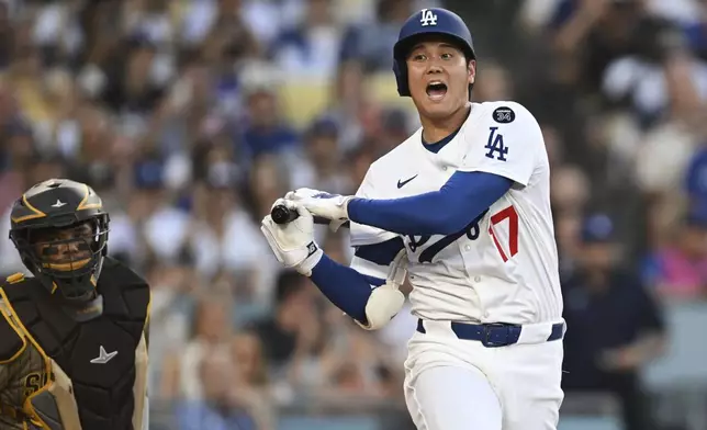 Los Angeles Dodgers' Shohei Ohtani reacts has he bats during the first inning of a baseball game against the San Diego Padres, Monday, June 16, 2025, in Los Angeles. (AP Photo/Kyusung Gong)