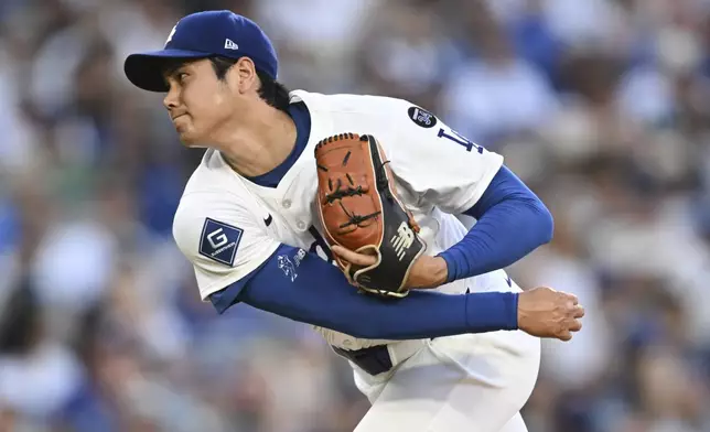 Los Angeles Dodgers starting pitcher Shohei Ohtani throws to a San Diego Padres batter during the first inning of a baseball game Monday, June 16, 2025, in Los Angeles. (AP Photo/Kyusung Gong)